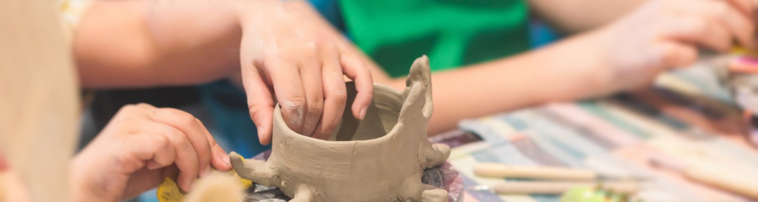 Pottery lesson master class for kids children, process of making clay pot on pottery wheel, potter wet hands creating ceramic crockery handcrafts, ceramist molding jar or vase